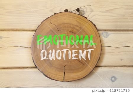 EQ emotional quotient symbol. Concept words EQ emotional quotient on beautiful wooden circle. Beautiful wooden wall background. Business psychology EQ emotional quotient concept. Copy space. 118731759