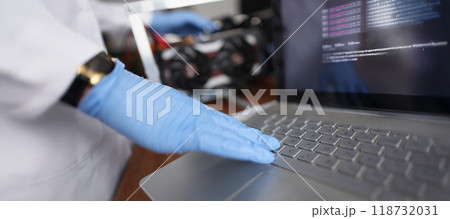 Professional technician man touching laptop keyboard wearing sterile gloves 118732031