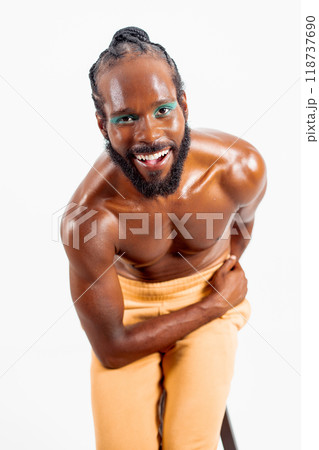 Happy African American shirtless gay model bending Happy African American shirtless gay model bending 118737690