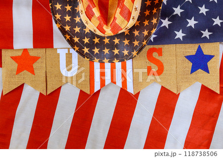 Symbolizing America, holiday banner with flag of United States displays an inscription that reads US Symbolizing America, holiday banner with flag of United States displays an inscription that reads US 118738506