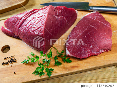 Pieces of raw thick beef steaks 118740207