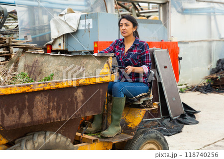 woman working on Forklift loader 118740256