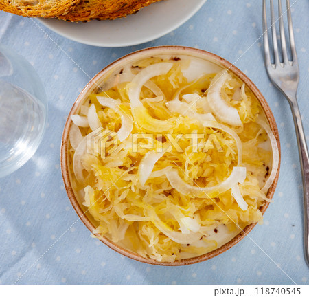 Plate of natural fermented sauerkraut seasoned with onions Plate of natural fermented sauerkraut seasoned with onions 118740545