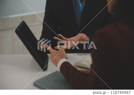 At a modern veterinary clinic, a Panshi Tzu puppy sits on an examination table. Meanwhile, a female veterinarian assesses the health At a modern veterinary clinic, a Panshi Tzu puppy sits on an examination table. Meanwhile, a female veterinarian assesses the health 118740987