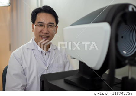 Professional ophthalmic sitting at phoropter machine, Eye health check and ophthalmology Professional ophthalmic sitting at phoropter machine, Eye health check and ophthalmology 118741755