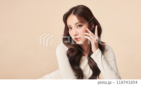 Beautiful young asian woman with clean fresh skin on beige background, Face care, Facial treatment, Cosmetology, beauty and spa, Asian women portrait. Beautiful young asian woman with clean fresh skin on beige background, Face care, Facial treatment, Cosmetology, beauty and spa, Asian women portrait. 118741854