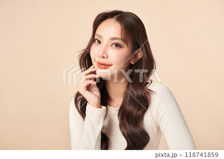 Beautiful young asian woman with clean fresh skin on beige background, Face care, Facial treatment, Cosmetology, beauty and spa, Asian women portrait. 118741859