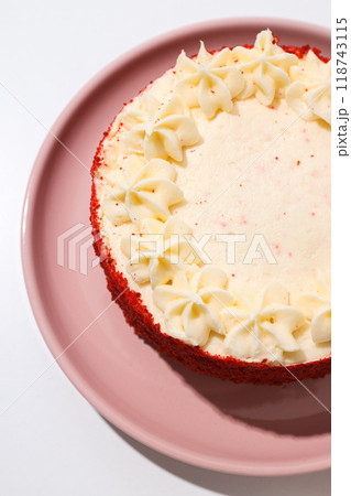 Red velvet cake on pink plate on white background, top view 118743115