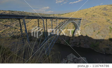 Iconic Half-Arch Iron Bridge Over Duero River Canyon 118744786