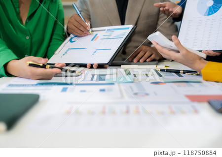 financial asian advisor showing plan of investment to clients in the consultancy office. 118750884