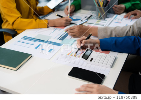 financial asian advisor showing plan of investment to clients in the consultancy office. financial asian advisor showing plan of investment to clients in the consultancy office. 118750889