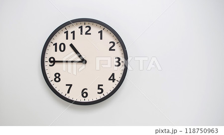 Classic Black-Edged Clock on White Background at 22.45/10.45 - Perfect for Time Management and Text Space Classic Black-Edged Clock on White Background at 22.45/10.45 - Perfect for Time Management and Text Space 118750963