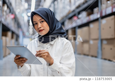 Muslim female wearing hijab warehouse worker  Muslim female wearing hijab warehouse worker  118753005