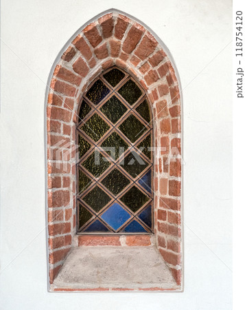Medieval window with stained glass in historical church Medieval window with stained glass in historical church 118754120
