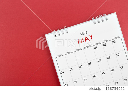 May 2025 desk calendar on red background. May 2025 desk calendar on red background. 118754922