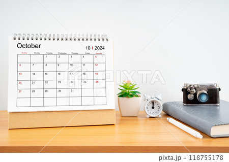 Desktop Calendar for October 2024 year and vintage camera with diary for Planner to plan timetable. 118755178