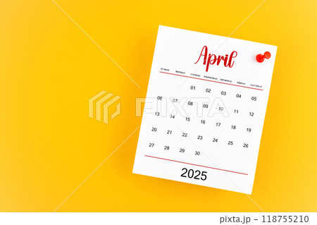 April 2025 calendar page with red push pin on yellow background. 118755210