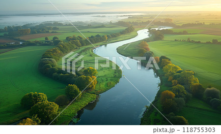 Aerial View of a Winding River Surrounded by Lush Green Fields at Dawn in Rural Landscape 118755303