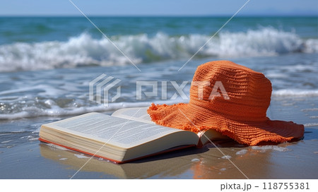 A Relaxing Day at the Beach With a Book and a Sun Hat Enjoying the Ocean Waves A Relaxing Day at the Beach With a Book and a Sun Hat Enjoying the Ocean Waves 118755381