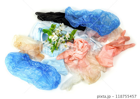 used gloves, medical masks and shoe covers. protection against coronavirus used gloves, medical masks and shoe covers. protection against coronavirus 118755457