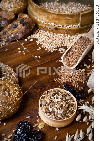 Assortment of baked bread on wooden table background 118755533