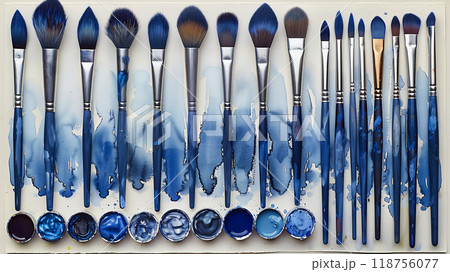 A Vibrant Collection of Paintbrushes and Watercolors Arranged Neatly on a White Background 118756077