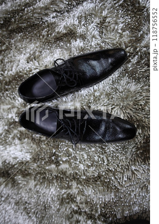 Pair of very stylish gentleman shoes glossy black shoes very luxurious and expensive shoes, conveying style and sophistication of a successful businessman 118756552