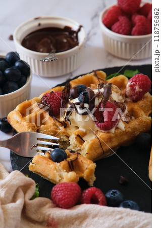 still life Belgian waffles on a black round plate 118756862