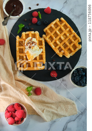 still life Belgian waffles on a black round plate 118756866