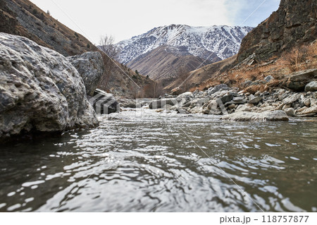 Calm water flow in a mountain river Calm water flow in a mountain river 118757877