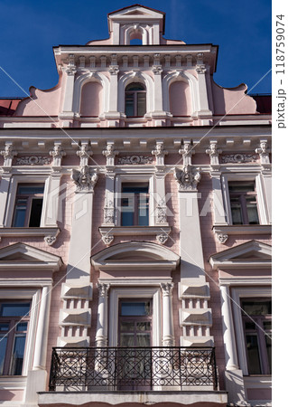 An old pink building in Moscow. The old facade of the building An old pink building in Moscow. The old facade of the building 118759074