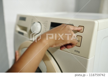 Adjusting Settings on Modern Washing Machine 118759742