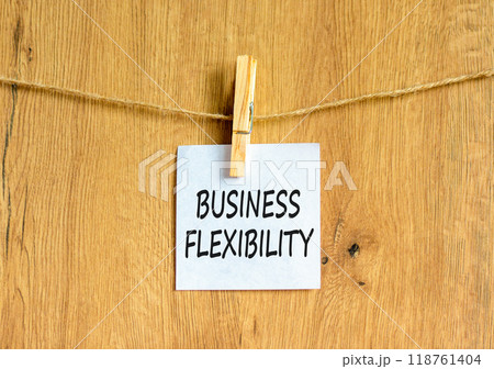 Business flexibility symbol. Concept words Business flexibility on beautiful white paper on wooden clothespin. Beautiful wooden background. Business flexibility concept. Copy space. 118761404