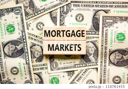 Mortgage markets symbol. Concept words Mortgage markets on beautiful wooden blocks. Dollar bills. Beautiful background from dollar bills. Business mortgage markets concept. Copy space. Mortgage markets symbol. Concept words Mortgage markets on beautiful wooden blocks. Dollar bills. Beautiful background from dollar bills. Business mortgage markets concept. Copy space. 118761455