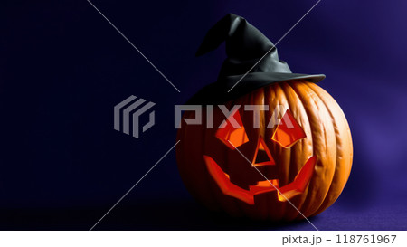 Halloween jack-o'-lantern wearing witch hat with glowing face Halloween jack-o'-lantern wearing witch hat with glowing face 118761967