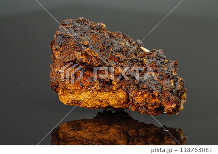 macro mineral Wulfenite stone on a black background macro mineral Wulfenite stone on a black background 118763081