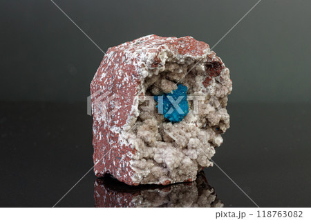 Macro mineral stone Cavansite on a gray background 118763082