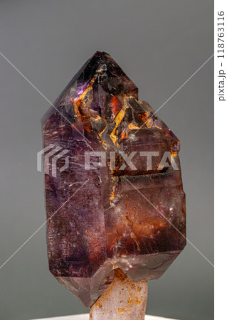 macro mineral stone  amethyst with smoky quartz on a black background 118763116