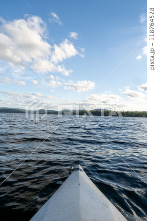 A beautiful view looking out from a kayak on Conway Lake in New Hampshire. 118764528