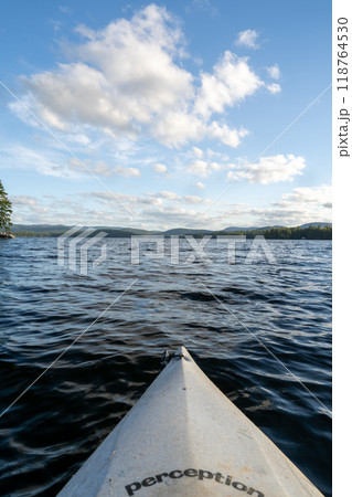 A beautiful view looking out from a kayak on Conway Lake in New Hampshire. 118764530