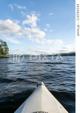 A beautiful view looking out from a kayak on Conway Lake in New Hampshire. A beautiful view looking out from a kayak on Conway Lake in New Hampshire. 118764544