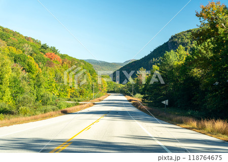 A winding road with view of mountains in White Mountain National Forest. 118764675