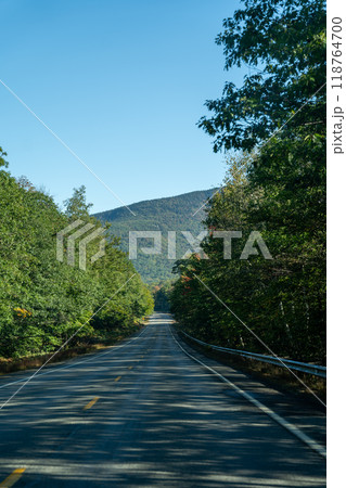 A winding road with view of mountains in White Mountain National Forest. 118764700