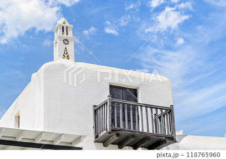 Myconos, views of the white houses with their cobbled streets. Village bathed by the South Aegean Sea, in the Cyclades, Greece Myconos, views of the white houses with their cobbled streets. Village bathed by the South Aegean Sea, in the Cyclades, Greece 118765960