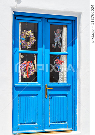 Blue door, typical of a house on the island of Myconos, Cyclades, Greece 118766024