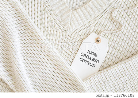 Knitted clothing labeled 100% organic cotton. Knitted clothing labeled 100% organic cotton. 118766108
