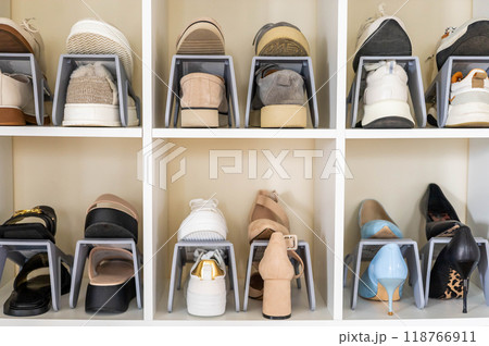 Shoes contemporary storage at home cupboard with shelves cozy room with potted plant interior Shoes contemporary storage at home cupboard with shelves cozy room with potted plant interior 118766911