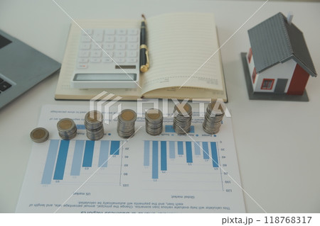 Saving money wealth concept, asian young business woman hand write management budget for saving cost, cash finance planning to spend enough money on her income for save money, payment tax, investing. Saving money wealth concept, asian young business woman hand write management budget for saving cost, cash finance planning to spend enough money on her income for save money, payment tax, investing. 118768317