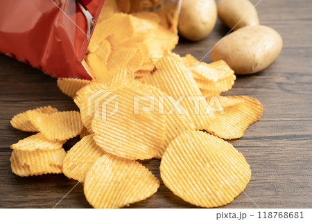 Potato chips , delicious BBQ seasoning spicy for crips, thin slice deep fried snack fast food. Potato chips , delicious BBQ seasoning spicy for crips, thin slice deep fried snack fast food. 118768681
