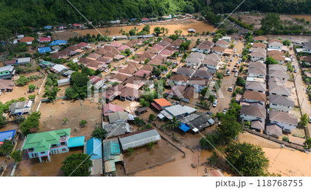 Aerial view of housing estate in suburb of Chiang Rai flooded by Kok river after typhoon Yagi has swept Southeast Asia. Aerial view of housing estate in suburb of Chiang Rai flooded by Kok river after typhoon Yagi has swept Southeast Asia. 118768755